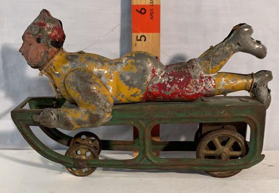 1 Dayton toy man on sled: 8 1/2 inches wide see photos Friction gear missing as is
