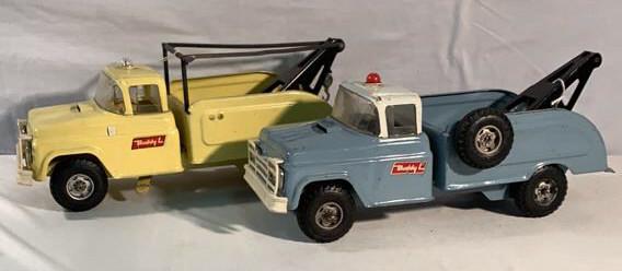 2 Buddy L Tow Trucks See description: Yellow truck missing spare tire and side mirror as is Blue truck missing tow hook see photographs