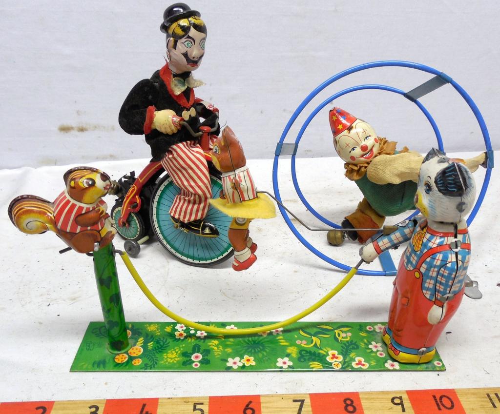 3 Tin Litho Wind-up toys Man on Bike, Clown and: Cat & Squirrel playing Jump Rope all work - used see photos