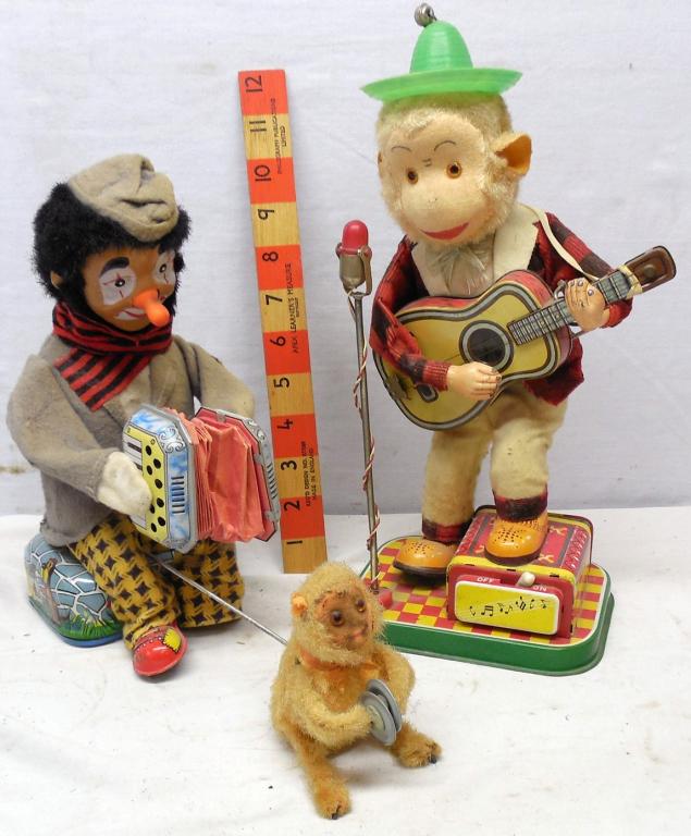 Organ Grinder and Monkey and Monkey Guitar player: Battery Operated Used see photos