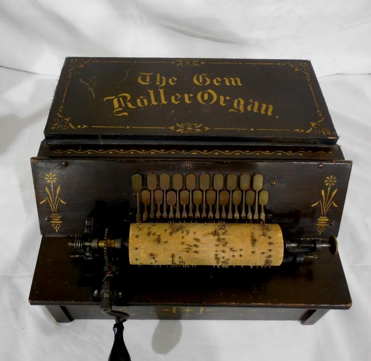 The Gem Roller Organ w/ 10 Rollers: Working Condition 8'' tall x 13 1/2'' wide bellows like new