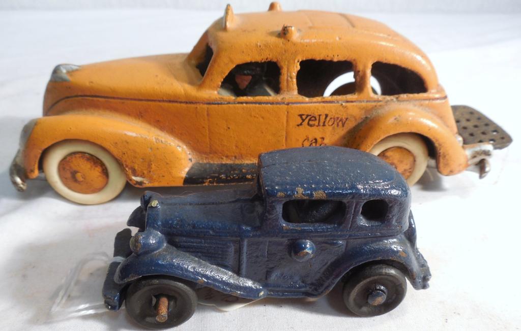 Cast Iron Taxi and Blue Cast Iron Car: Both repainted possible reproductions you be the judge buy as is