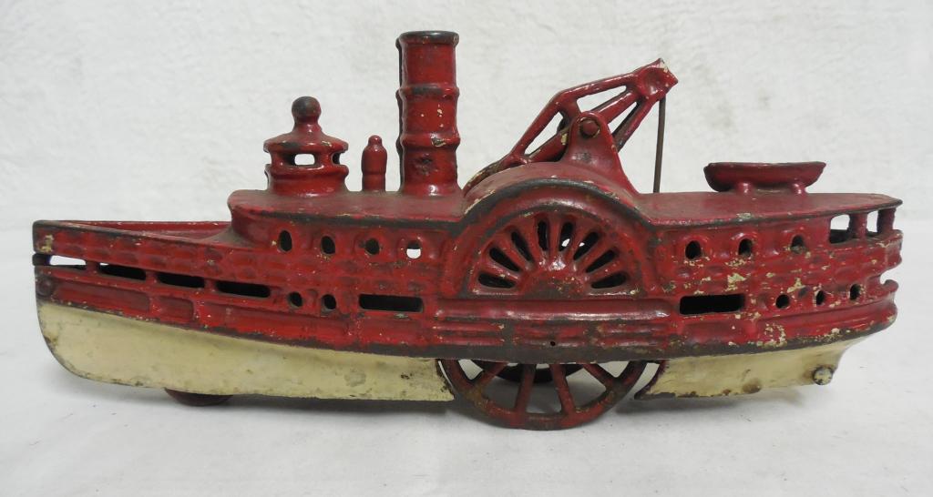 Cast Iron Riverboat see photos for condition 11" Long: see photos for condition Back end looks chipped
