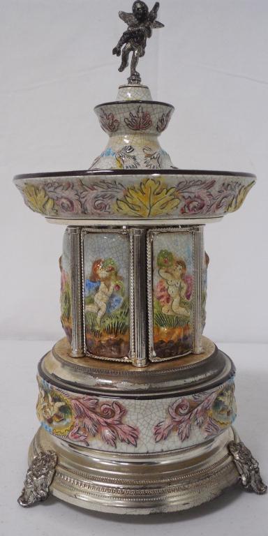 carousel cigarette/lipstick music box works, shows a: works, shows a lot of wear
