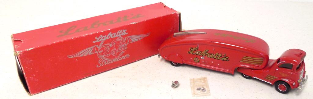 DeHanes Labatt's Streamliner metal truck w/ box: coupler and rear view mirrors not attached, decals on toy are lifting at spots especially the grille, The 1986 World Exposition labelled on bottom, 9" long