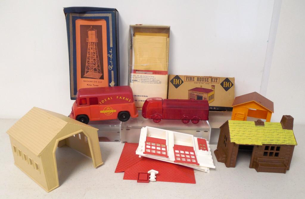 lot of plastic cars & buildings Mattel & others: some unassembled & may or may not be complete, Plasticville box has damge to lid, Real-Like, Ideal Farms Milk truck has broken steering wheel