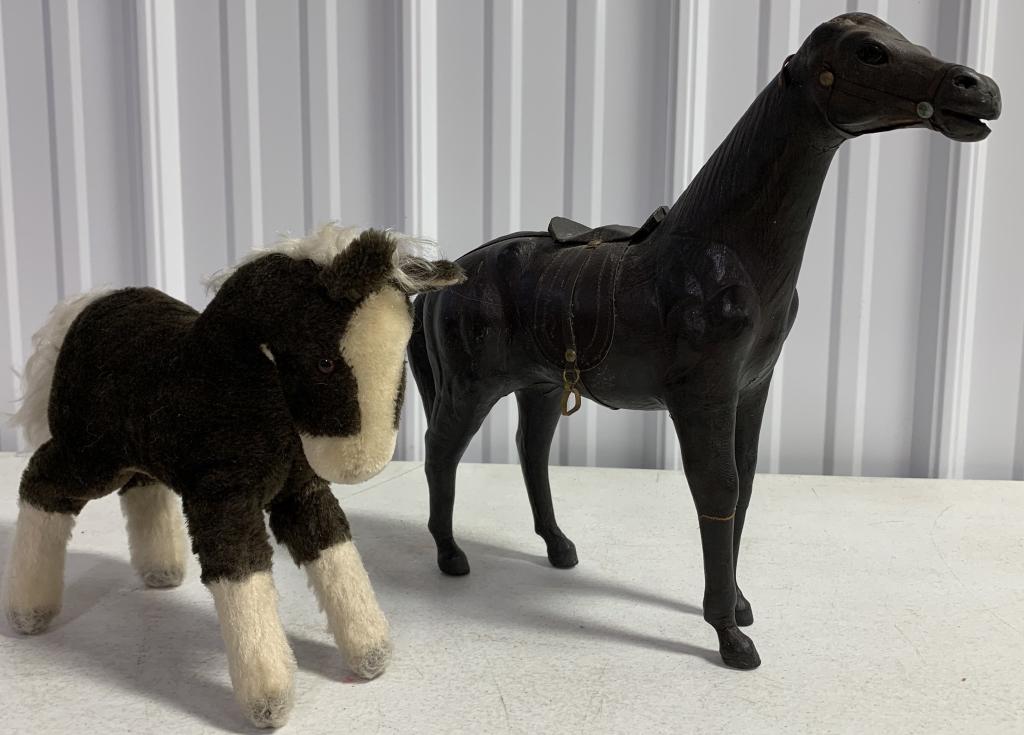 lot of 2 Horses one is Steiff: smaller horse has Steiff tag in ear, taller horse is missing his ears, one stirrup is missing, possibly leather over wood, cracking underneath the head and between the legs, bridle torn,
