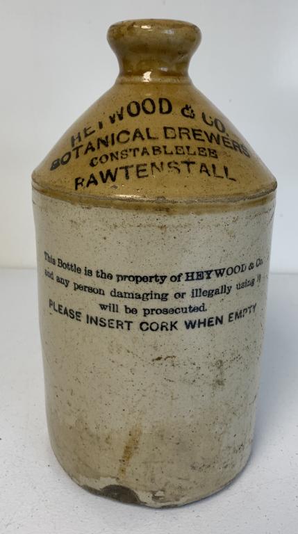 Heywood & Co Botanical Brewers Stoneware Jug: side of handle chipped, partial stamp on side says Pearson & Co, chip out of bottom edge front side, small chip out of bottom of jug