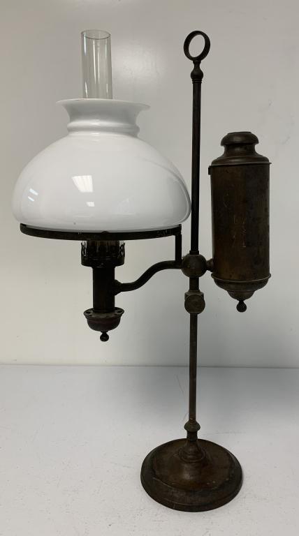 Kerosene/Oil Lamp: clear glass chimney is cracked and has a piece out of it at the base, white globe has a piece chipped off of edge, no names or markings, cast base, lamp has wear