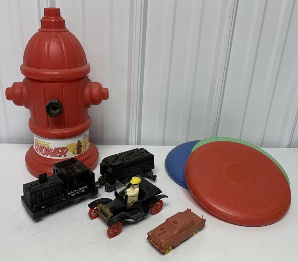 (9) Frisbees, Kiddie Shower, Marx Trains others: Salt shaker man in plastic car, plastic police car, Transogram Kiddie Shower with label, most toys look used