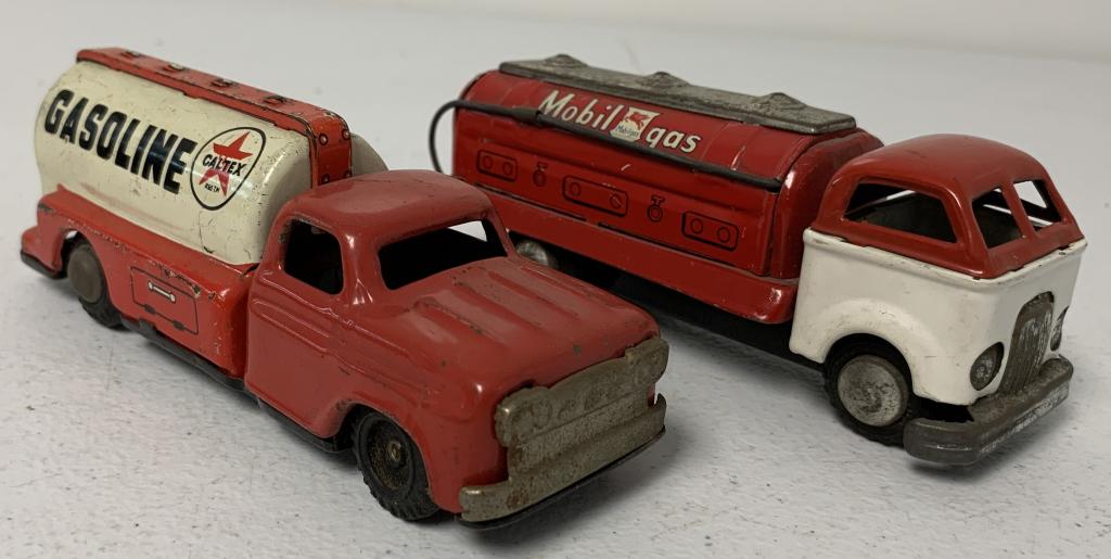 lot of 2 Mobil & Caltex Metal Trucks: Mobil is a friction toy, both have paint wear, some scratches, silver metal has tarnished, both stamped made in Japan