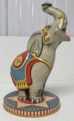 Unique Art Mfg Co. Flying Circus Tin Elephant: hole at the end of his trunk that may be missing an item, light scratches throughout