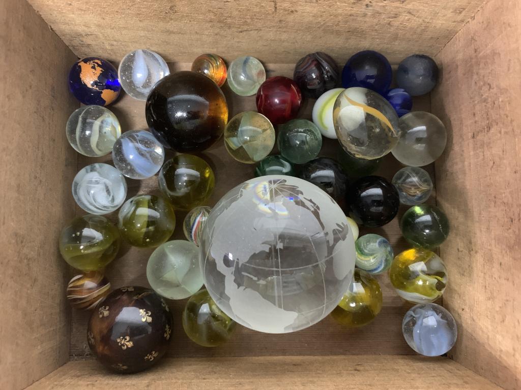 lot of 25+ Marbles with Different Diameters: large globe is 2 1/2" diameter, another large one is 1 1/2" diameter, a lot of 1' diameter, some are lighter weight, one is damged