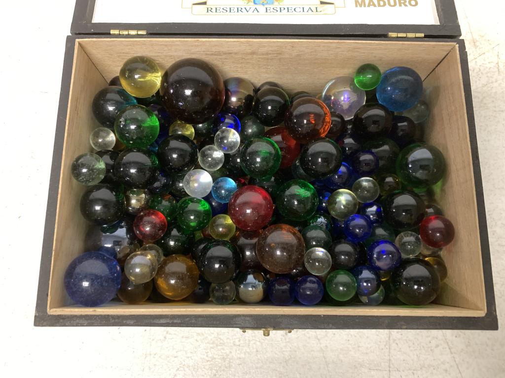 lot of 60+ Different Marbles w/ Solid Colors: different diameters, one is 1 1/2" diameter, some are 1" diameter, a lot are 1/2" diameter