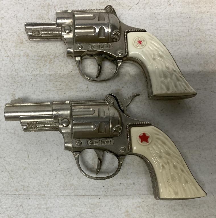lot of 2 Hubley 2-in-1 cap guns: one has broken barrel, possibly have been used at one time