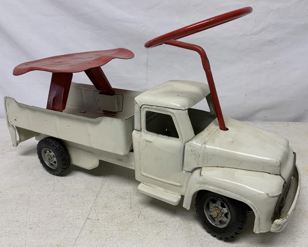 Pressed Steel Buddy L Child's Riding Toy: steering wheel turns and wheels turn, decal worn away, some paint chippedsmall dent at back side, may be missing some sort of gate