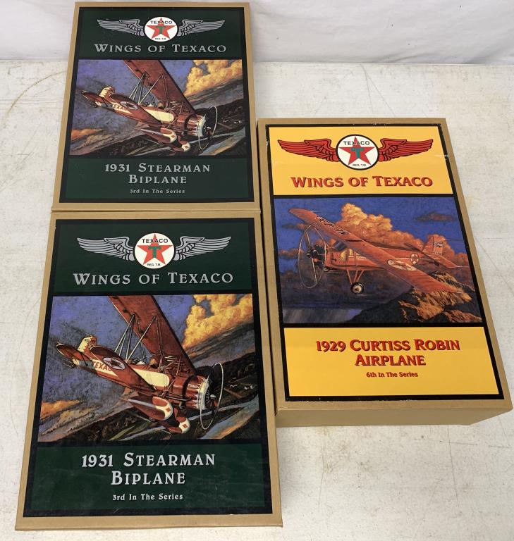 lot of 3 Wings of Texaco Die Cast Airplane Banks: Ertl, new in box, two of the 3rd in a series 1931 Stearman Biplane & one 6th in a series 1929 Curtiss Robin airplane