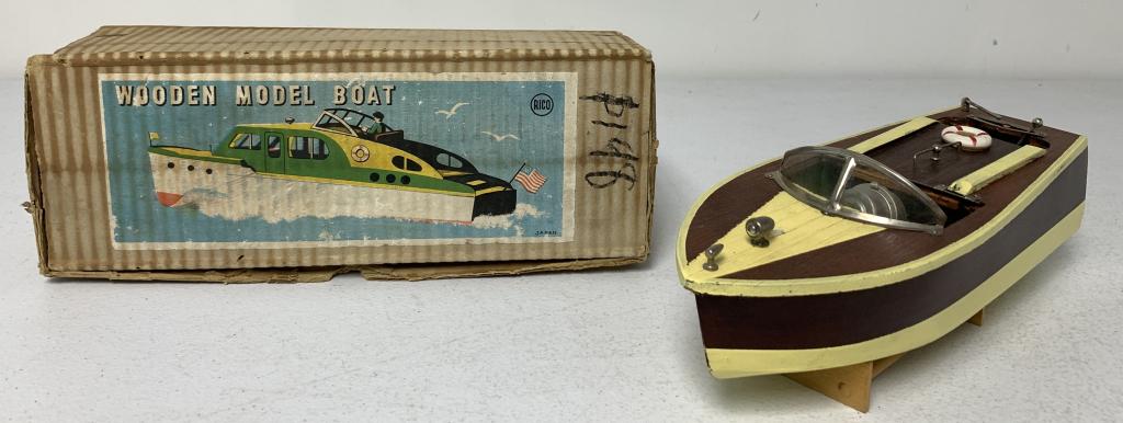 Rico Battery Operated Wooden Boat & Box: untested, some yellow paint chipped away at stern, flag inside boat, rudder stamped Rico Japan, box has age, wear, and stains