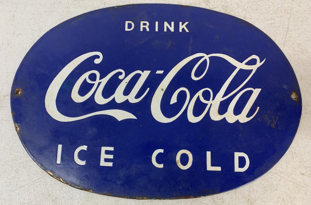 Fantasy Sign, Porcelain Coca Cola Blue Background Sign: reproduction, single sided, some enamel worn away at some of the edges and the holes and those areas are beginning to rust, fair amount of rust on back side