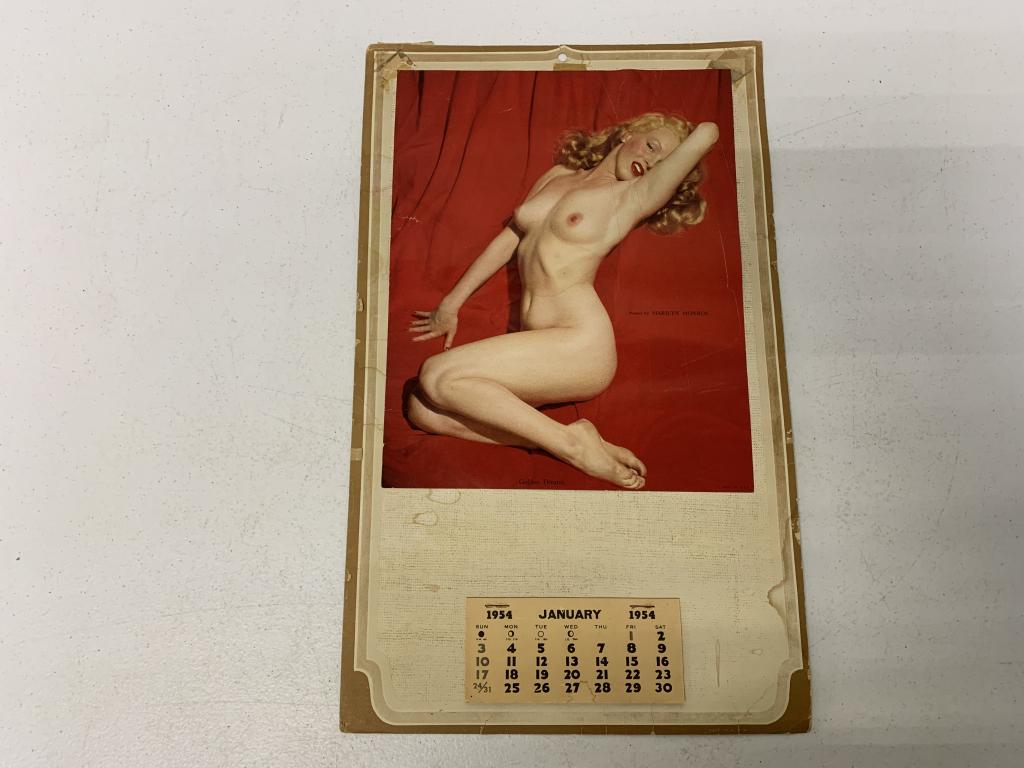 1954 Calendar w/ Nude Marilyn Monroe Picture: Famous Marilyn Monroe pose attached to a 1954 calendar, calendar has lots of staining and tape marks