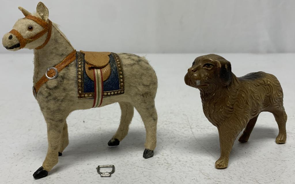 lot of 2 Celluloid Dog Rattle & Toy Horse: dog rattle stamped made in USA and still rattles and has some scratched off paint, horse has some sort of fur like material on body and only has one stirrup and it is not attached and it looks like it