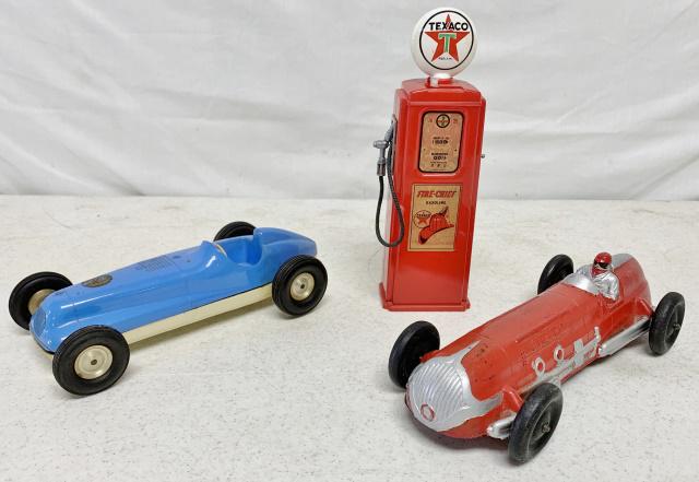 (3)Auburn Car, Texaco Gas Pump Bank, other: red Auburn car is hard rubber and has light paint wear, rubber has hardened over age, blue race car is windup and is plastic, has no names or markings, Gas Pump is plastic, broken piece near coin slot