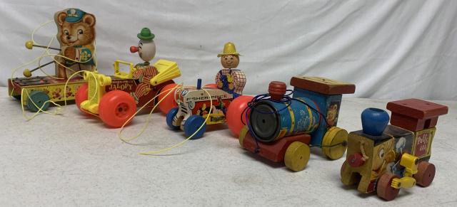 lot of 5 Fisher Price Pull Toys: all are wooden with decals stuck on the wood, decals have some age and wear, engine missing part of rubber on back wheel, Puffy missing the string, all wheels turn on all toys