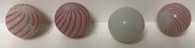 4 red/white clambroth Marbles 11/16" each: one chipped,one missing stripes