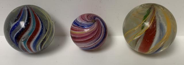3 red/white/blue orange swirled marbles: 7/8"multi colored,has a few scratches,1 1/8",1 3/16" few scratches, two have core swirls