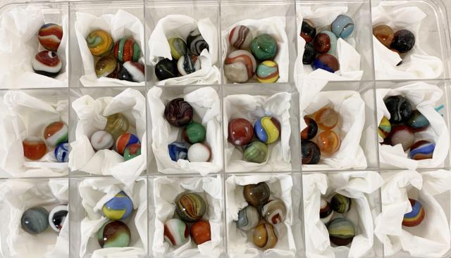 lot of 60+ Glass Contemporary Marbles: largest ones are around 7/8" diameter andf the smallest ones are around 5/8" diameter