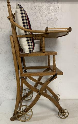 oak convertible stroller/highchair w/ Santa pillow: has cast iron wheels