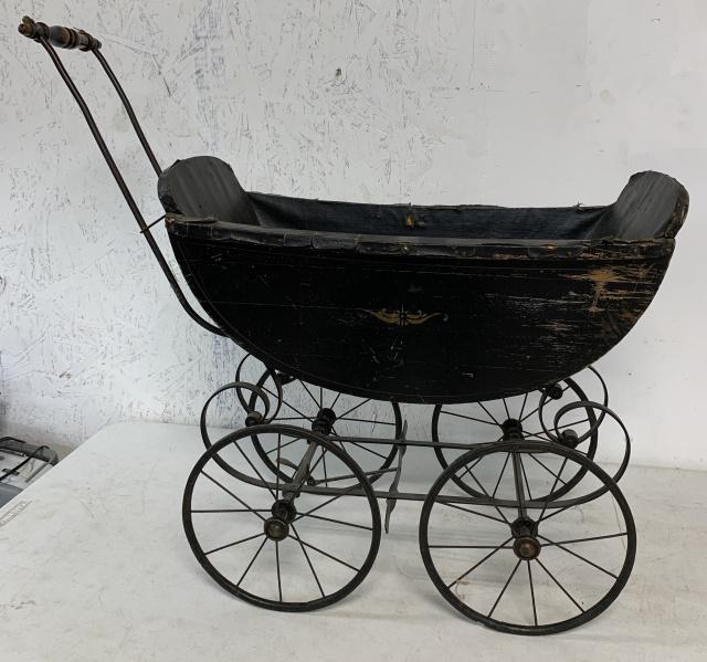 F.A. Whitney Carriage Co. doll carriage: made in Leominster, Mass., has loss to paint and oil cloth liner; 31" long x 29" tall x 12" wide