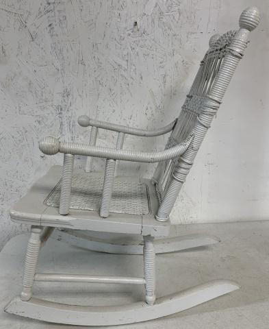 white child's wooden rocker: wood has some splits, weaving has some breaks