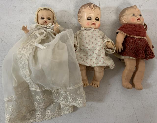 3 rubber/plastic baby dolls: small one in christening gown(torn) sqeaks; doll in flowered pajama marked Sunbabe "So-Wee" Ruth E. Newton; soft rubber in crochet dress sqeaks
