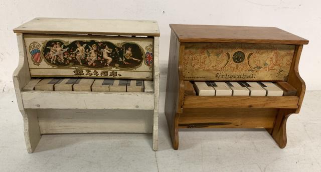 NNC Bliss and Schoenhut toy pianos: Bliss has some paint loss and wood chipped off back; Schoenut has color loss to litho and makes no noise