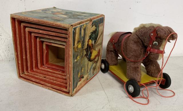 nesting blocks and childs pony pull toy: nesting blocks show heavy wear and loss to paper as shown, largest has a split wood side and next to smallest is missing a piece of wood to one side; pull toy is in played with condition
