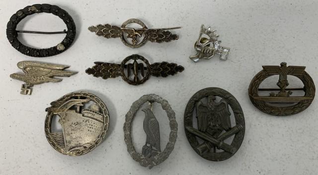 lot of 9 Nazi Pins/Uniform Badges: cannot authenticate, look like they have some wear and use, larger one stamped fec. Otto Placzek Berlin Ausf. Schwerin Berlin