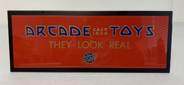 Arcade Cast Iron Toys Glass Sign on Wood Back: small imperfections on bottom edge of glass, may be contemporary