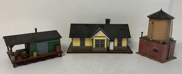 lot of 3 Lionel Plastic Buildings: green general store has a broken hole on the bottom, water tank has a broken spout, all with wear and age