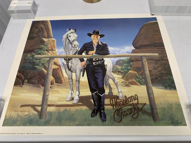 Hopalong Cassidy poster in mailing tube: 24 1/2 in.wide by 20 1/2 in. high. Signature of Paul Wentzel--signature not authenticated. Tape marks and light soiling. See photos