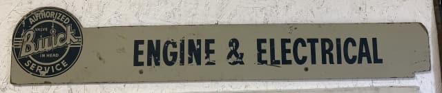 Buick Engine & Electrical Single Sided Sign: sign is masonite, litho has wear throughout, letters chipped away at spots, litho is worn from the masonite at spots, 8" tall X 43" long