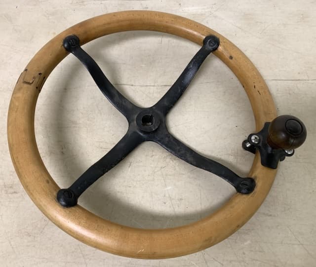 Steering Wheel: stamped 1902 with the number 5 on inside iron part, wood has some cracks and separation, also comes with knob attached, no names