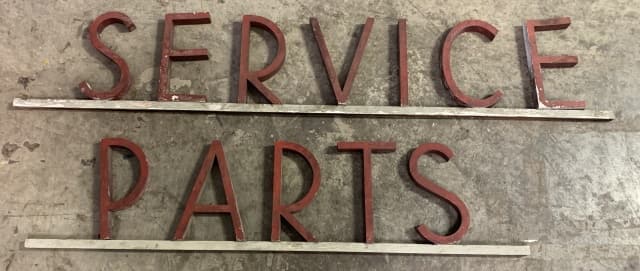 lot of 2 Service Parts Sign: letter P in parts comes off board, letter S in parts is broken, letters are wooden, some are loose on board, worn paint, service is 60" long & 11" tall, parts is 47" long & 11" tall