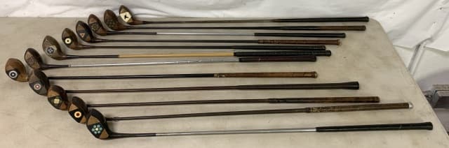 lot of 12 Vintage Golf Club Woods: World-Win Driver, Brassie, Custom B Built, Walter Hogan, Wilson, McGregor, Westchester, most with wooden shafts, all with a lot of wear and use