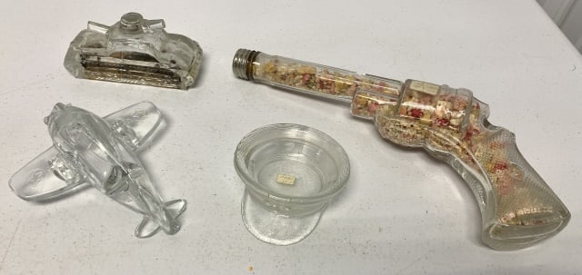 4 glass candy containers: gun has chip in barrel end under screw cap, plane is missing propeller and wings have rough edges, tank has flakes off base