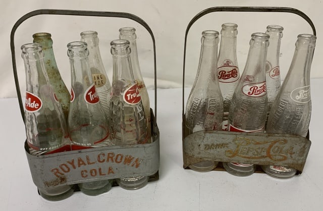 Pepsi Cola and Royal Crown metal bottle carriers: carriers are well worn showing paint loss and rust; there are five Pepsi bottles, 3 Tru-Ade, 1 Royal Crown, 1 Jefferson Club and 1 Brownie; all bottles show wear to varying degrees(see photos)
