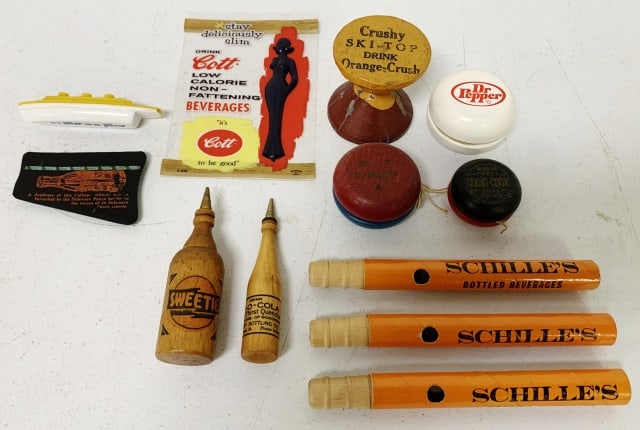 (12)Ads Dr. Pepper, Orange Crush,Re-O-Cola: whistles, yo-yo's, Schille's Bottled beverages, Cott Beverages, others
