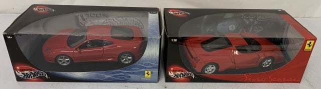 2 Hot Wheels Ferrari diecast cars in boxes: 360 Modena and Enzo; Enzo has been displayed in case out of box and is loose; 360 Modena box has heavy wear
