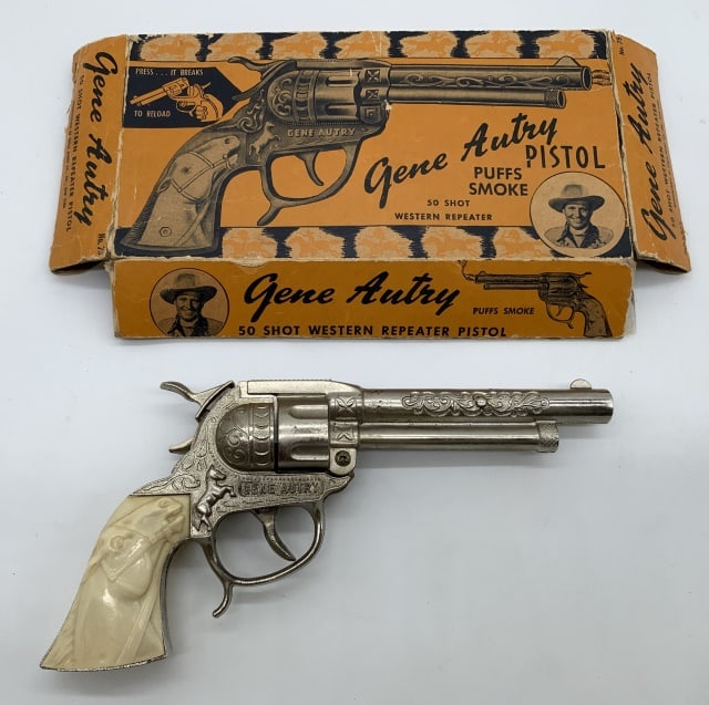 Gene Autry Western Toy Cap Repeater Pistol: body of gun is cast, plastic handle grips, box has wear, missing part of the end flaps, one of the end flaps has been taped to the box