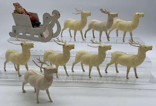 Irwin Santa w/ Sleigh & 8 Reindeer: celluloid, one reindeer missing the antlers, some discoloring of reindeer, sleigh seems like it is cardboard, Santa is cloth